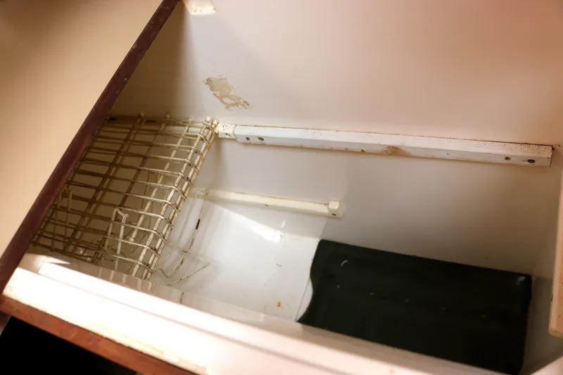 Slide: The Image of Interior of a 1993 Hunter 33.5 with storage space. - 28