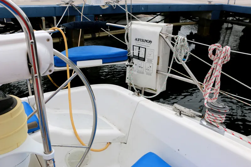 Slide: The Image of Cockpit of a 1993 Hunter 33.5 sailboat docked at marina. - 3