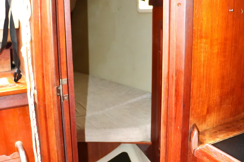 Slide: The Image of Interior of a 1993 Hunter 33.5 yacht with wooden finish. - 30