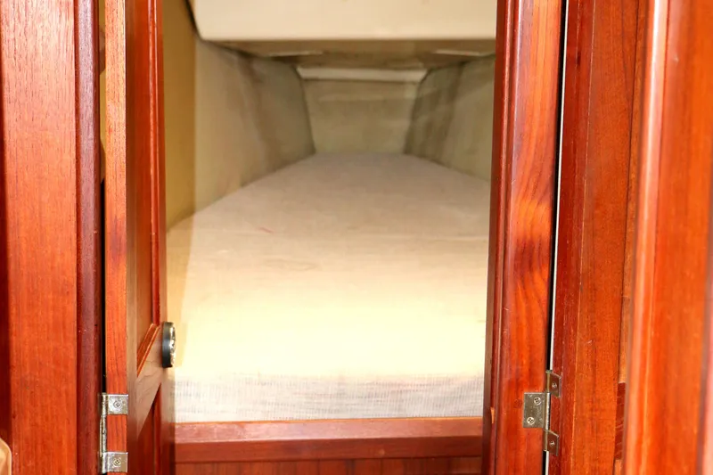 Slide: The Image of Interior of a 1993 Hunter 33.5 yacht with wooden doors. - 36