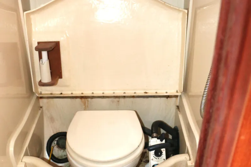 Slide: The Image of Interior of a 1993 Hunter 33.5 yacht featuring a toilet. - 40