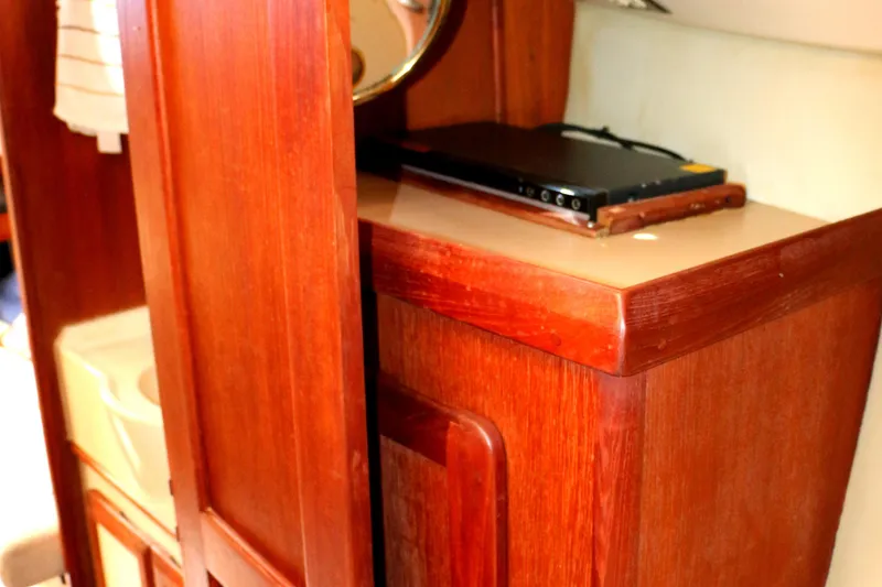 Slide: The Image of Interior of a 1993 Hunter 33.5 sailboat with wooden cabinetry. - 44