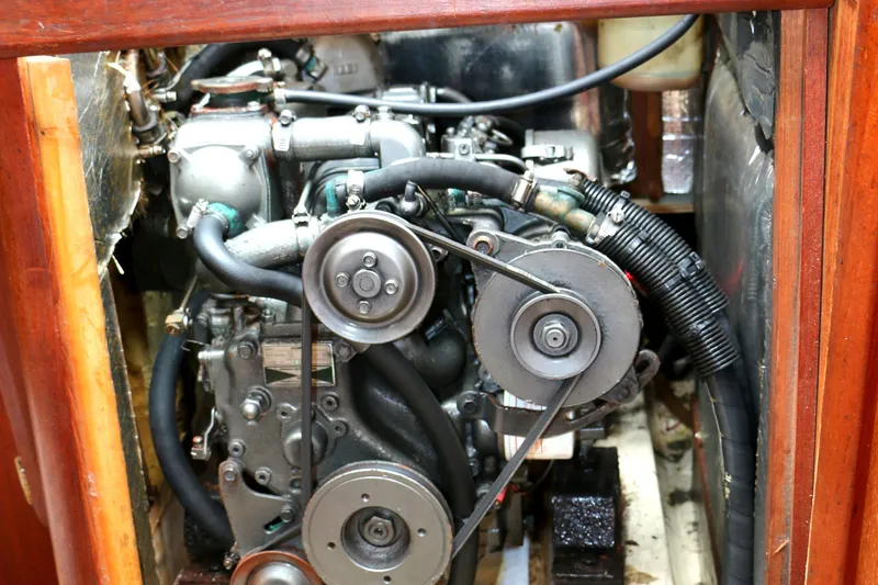 Slide: The Image of Engine compartment of a 1993 Hunter 33.5 boat with visible engine. - 48
