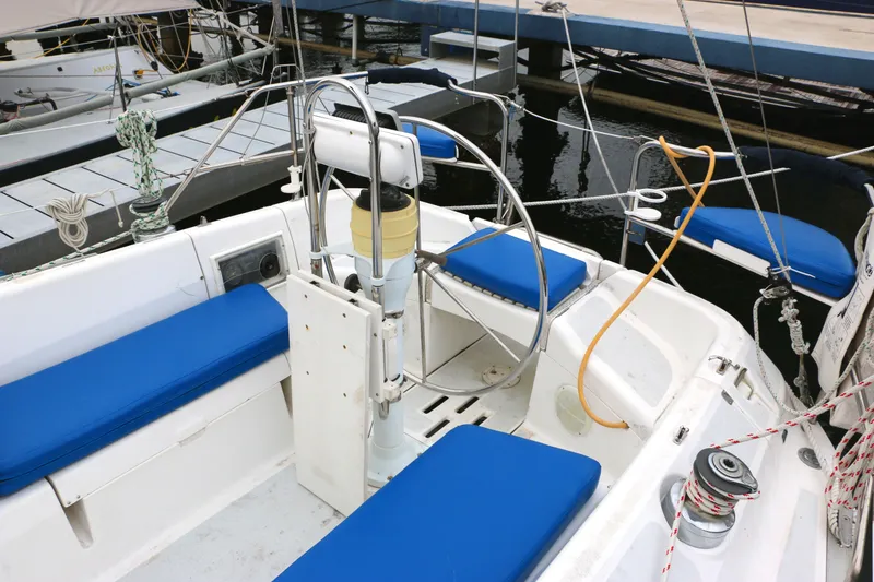 Slide: The Image of Cockpit of a 1993 Hunter 33.5 sailboat with blue cushions. - 5