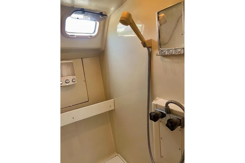 Slide: The Image of Shower area in a 1993 Hunter 33.5 boat with window and fixtures. - 59