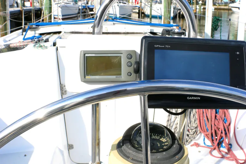Slide: The Image of 1993 Hunter 33.5 sailboat helm with GPS and compass. - 7