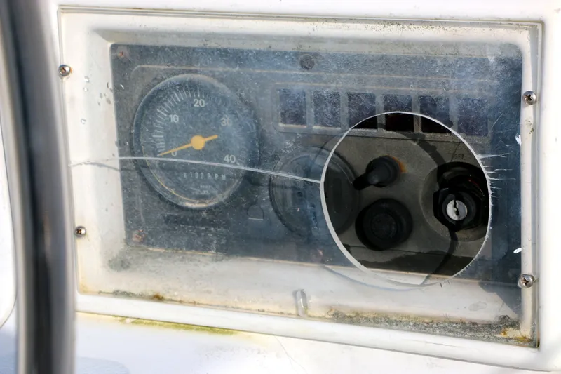 Slide: The Image of Dashboard of a 1993 Hunter 33.5 boat, featuring a tachometer. - 8