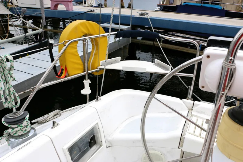 Slide: The Image of Cockpit of a 1993 Hunter 33.5 sailboat in a marina. - 9