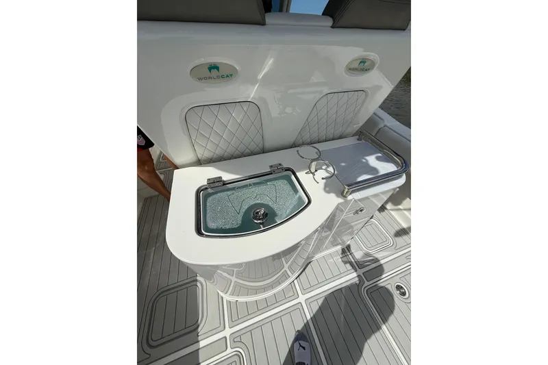 Slide: The Image of 2021 World Cat 280 CC-X boat interior with livewell and seating area. - 11