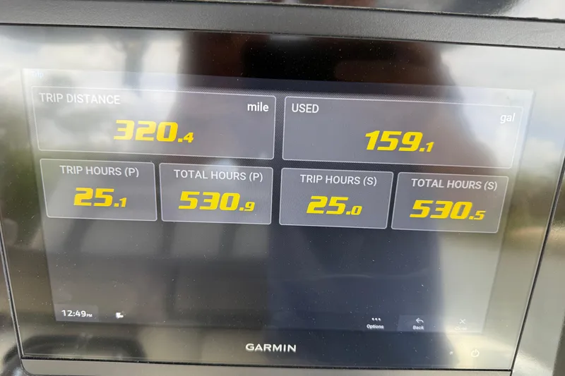 Slide: The Image of Garmin display showing trip data: 320.4 miles, 159.1 gallons used, 2021 World Cat 280 CC-X. - 13