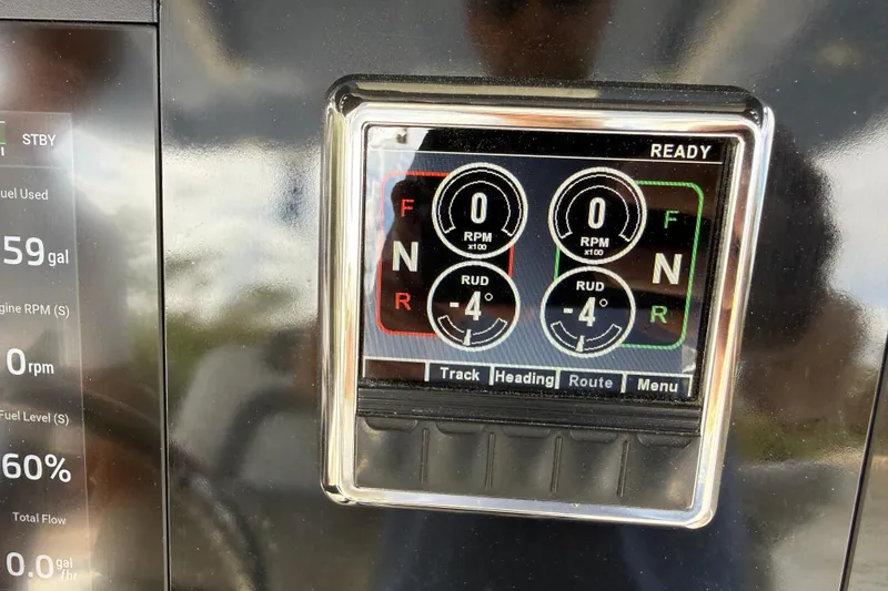 Slide: The Image of Dashboard display of a 2021 World Cat 280 CC-X boat showing RPM and rudder angle. - 14