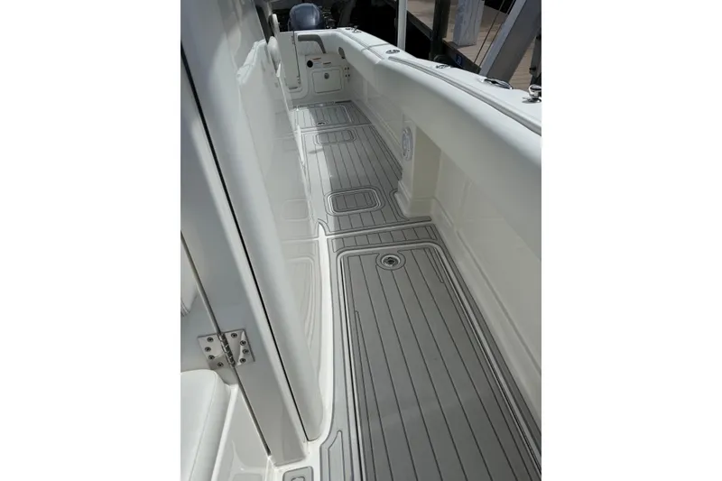 Slide: The Image of 2021 World Cat 280 CC-X boat deck with sleek, modern design and durable flooring. - 17