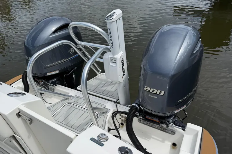 Slide: The Image of 2021 World Cat 280 CC-X boat with dual Yamaha 200 engines on water. - 19