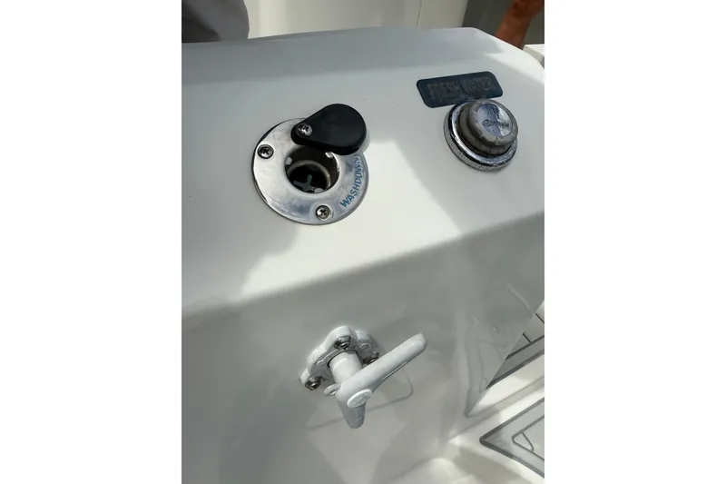 Slide: The Image of Freshwater and washdown ports on 2021 World Cat 280 CC-X boat. - 21