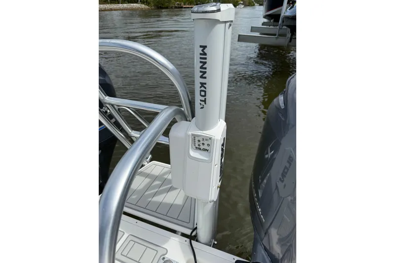 Slide: The Image of Minn Kota Talon anchor on 2021 World Cat 280 CC-X boat, docked on calm water. - 22