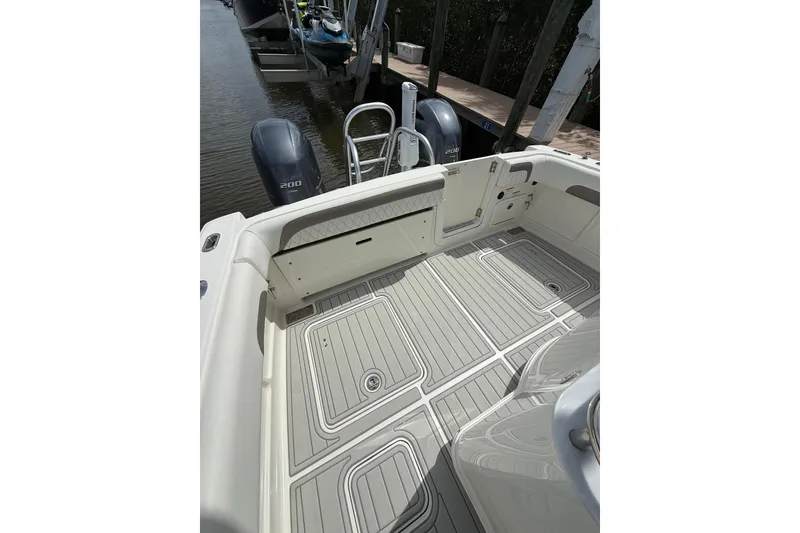 Slide: The Image of 2021 World Cat 280 CC-X boat deck with twin 200 engines at dock. - 9