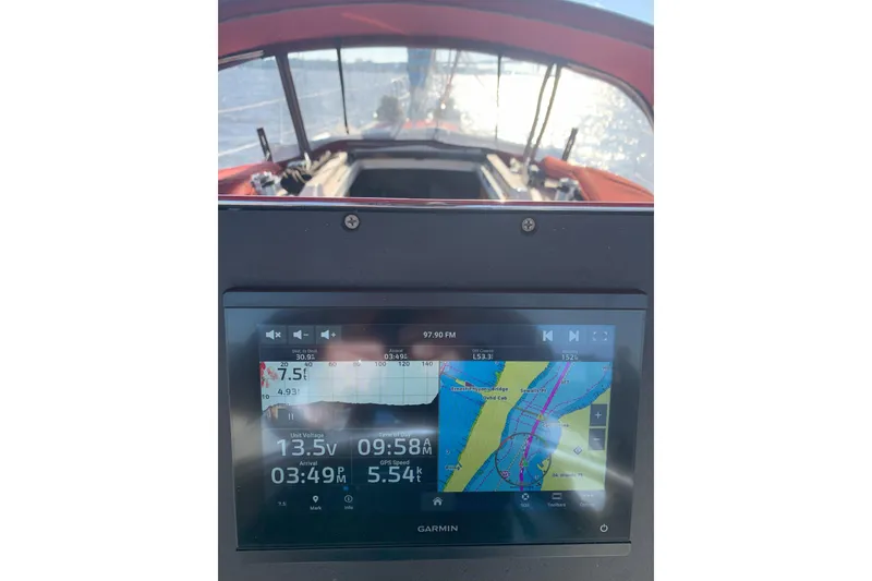 Slide: The Image of Garmin navigation display on 1989 Gib'Sea 37 sailboat, showing map and sailing data. - 12