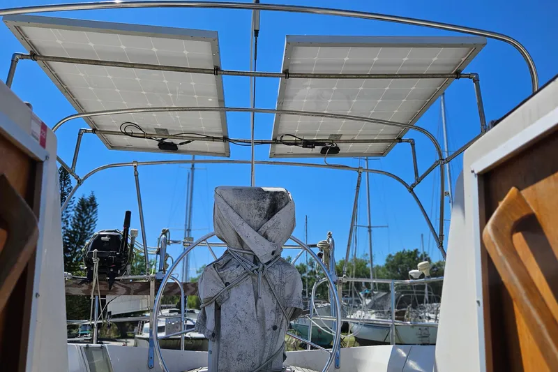 Slide: The Image of Sailboat cockpit with solar panels, Gib'Sea 37, 1989 model, sunny marina background. - 13