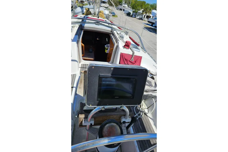 Slide: The Image of 1989 Gib'Sea 37 sailboat cockpit with navigation equipment and open cabin entrance. - 15