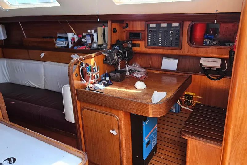 Slide: The Image of Interior of 1989 Gib'Sea 37 sailboat with navigation station and wooden cabinetry. - 19