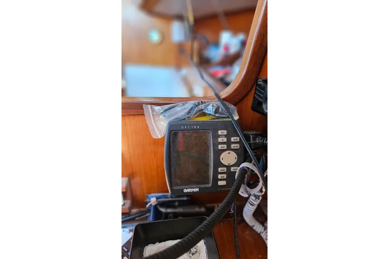 Slide: The Image of Garmin GPS device on 1989 Gib'Sea 37 yacht, mounted on wooden panel. - 21
