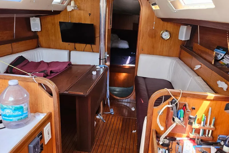 Slide: The Image of Interior of 1989 Gib'Sea 37 sailboat with wooden furnishings and seating area. - 23