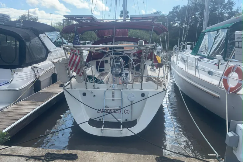 Slide: The Image of Gib'Sea 37 sailboat from 1989 docked at a marina, rear view. - 3