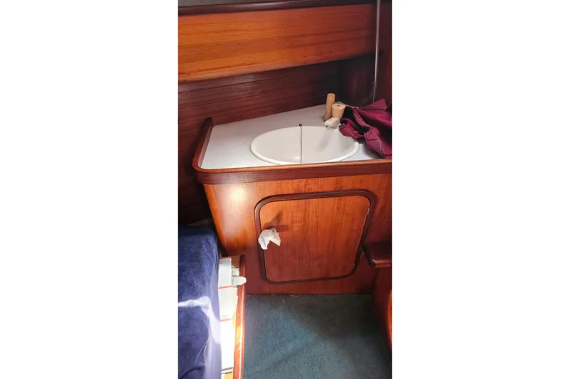Slide: The Image of Wooden bathroom vanity with sink in 1989 Gib'Sea 37 sailboat interior. - 30
