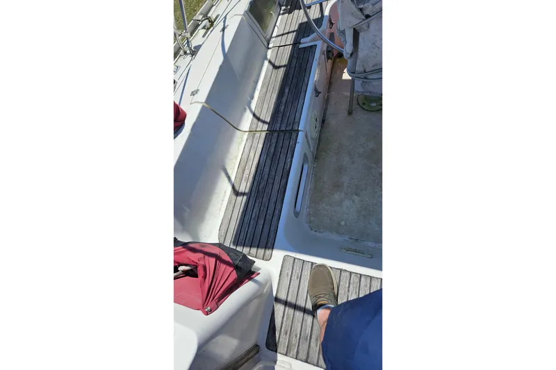 Slide: The Image of Cockpit view of 1989 Gib'Sea 37 sailboat with wooden flooring and equipment. - 31