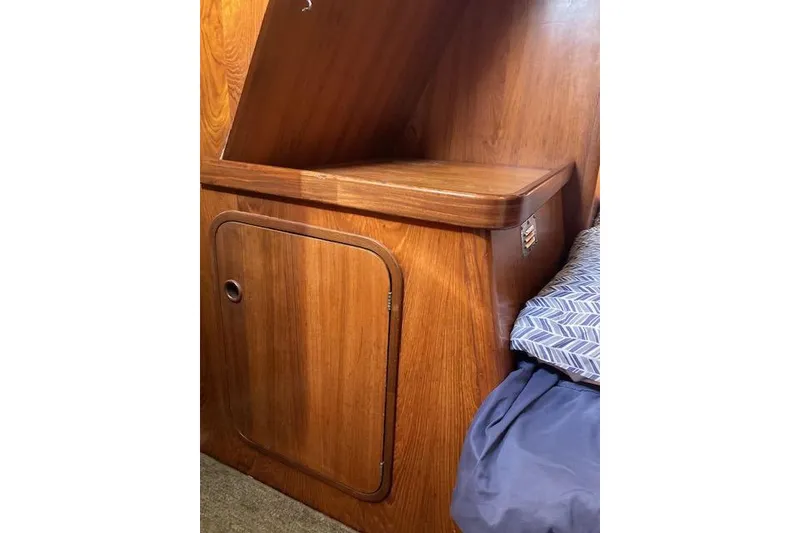 Slide: The Image of Wooden cabin interior of 1989 Gib'Sea 37 sailboat with storage compartment. - 35