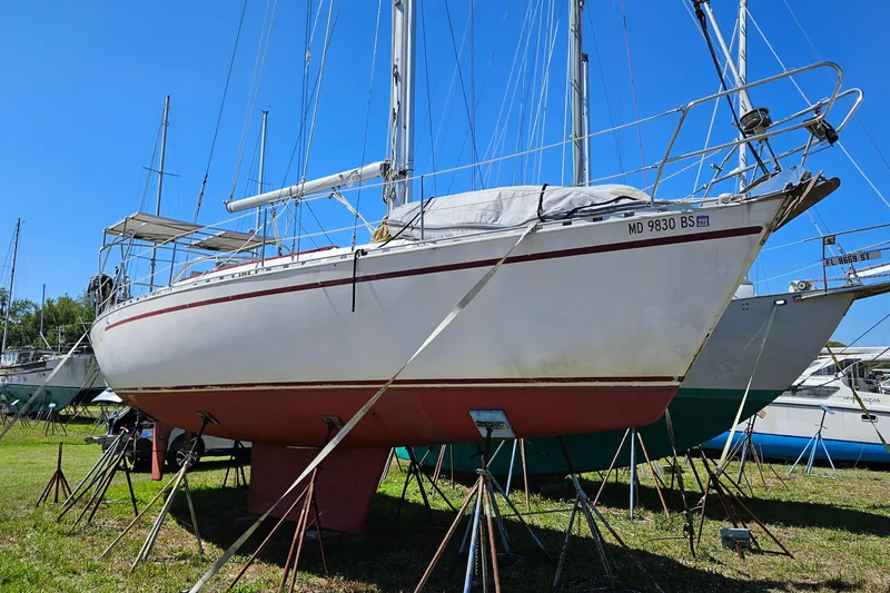 Slide: The Image of 1989 Gib'Sea 37 sailboat on stands, displayed outdoors under clear blue sky. - 6