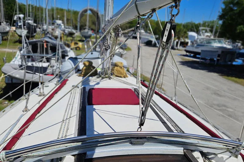 Slide: The Image of Sailboat deck view of 1989 Gib'Sea 37, docked with rigging and ropes visible. - 8