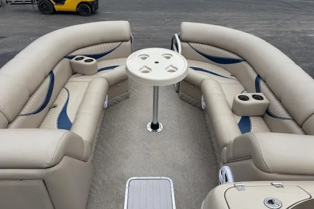 Slide: The Image of Luxurious interior of a 2011 Berkshire 243 SLX pontoon boat with beige seating. - 9