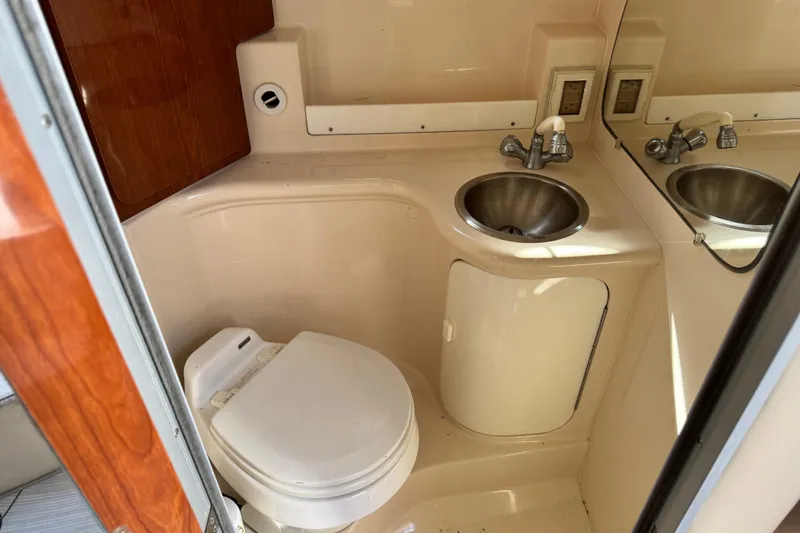 Slide: The Image of 2007 Regal Commodore 2665 boat bathroom with sink and toilet. - 10