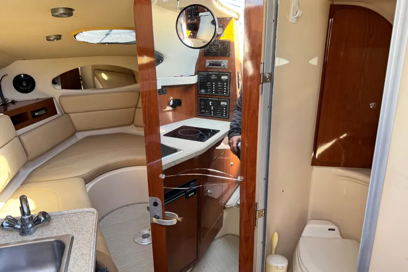 Slide: The Image of Interior of 2007 Regal Commodore 2665 boat with kitchenette and seating area. - 11