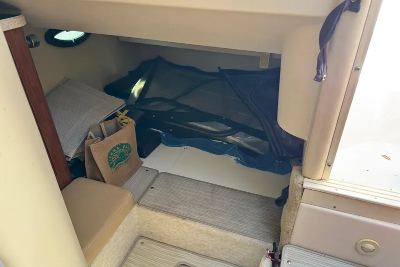 Slide: The Image of Interior cabin of 2007 Regal Commodore 2665 boat with storage items. - 12