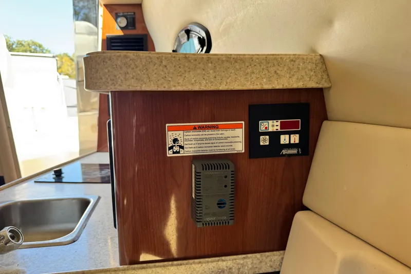 Slide: The Image of 2007 Regal Commodore 2665 interior with control panel and warning label. - 19