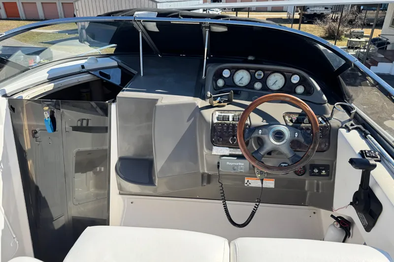 Slide: The Image of 2007 Regal Commodore 2665 boat cockpit with steering wheel and instrument panel. - 24