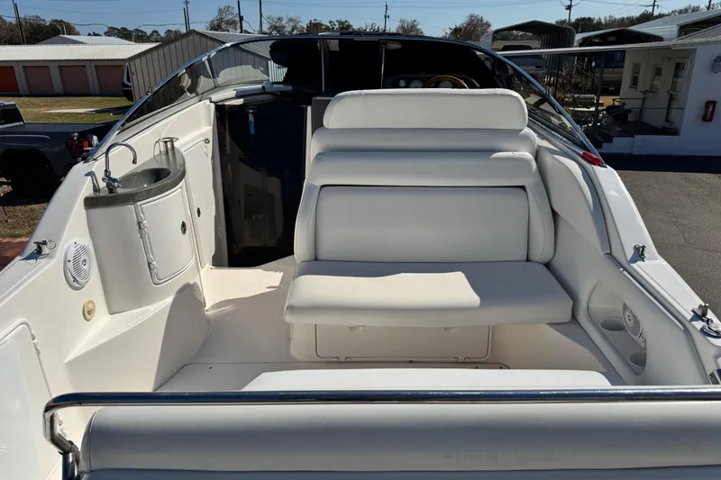 Slide: The Image of 2007 Regal Commodore 2665 boat interior with white seating and compact sink area. - 28