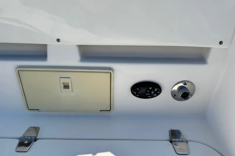 Slide: The Image of Control panel and access hatch on a 2007 Regal Commodore 2665 boat. - 30