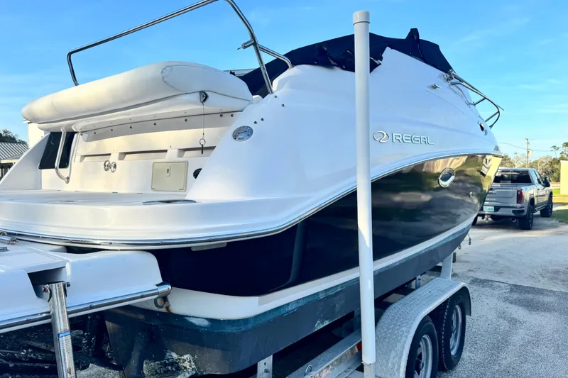 Slide: The Image of 2007 Regal Commodore 2665 boat on trailer, parked outdoors, rear view. - 4
