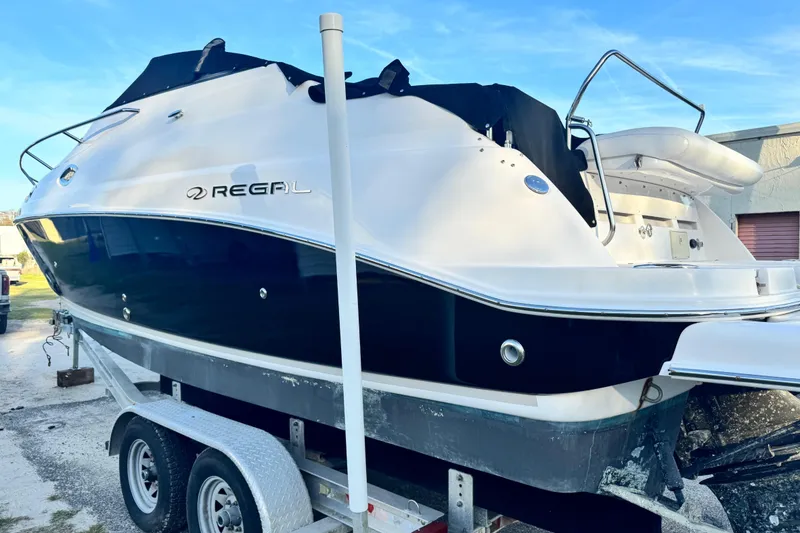 Slide: The Image of 2007 Regal Commodore 2665 boat on trailer, black and white exterior. - 5