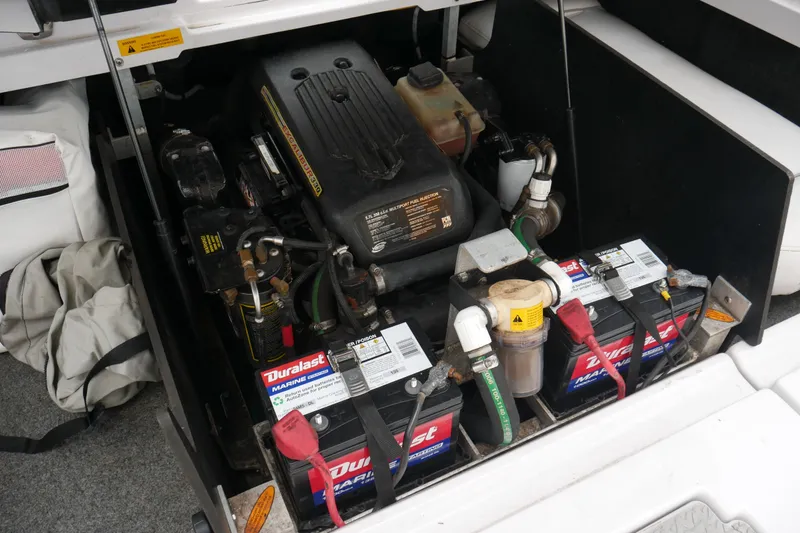 Slide: The Image of 2007 Correct Craft 236 Team Edition engine compartment with Duralast marine batteries. - 19