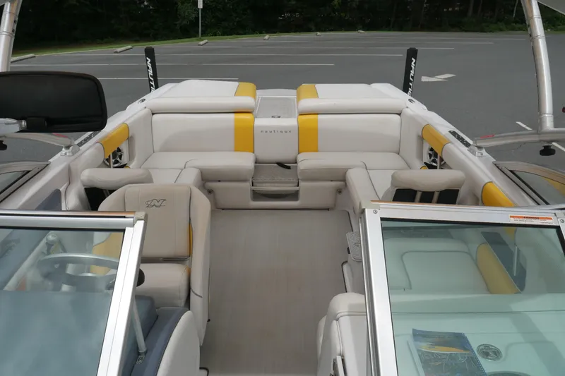 Slide: The Image of 2007 Correct Craft 236 Team Edition boat interior with yellow and white seating. - 22