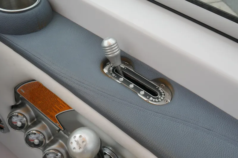 Slide: The Image of 2007 Correct Craft 236 Team Edition boat throttle and control panel close-up. - 38