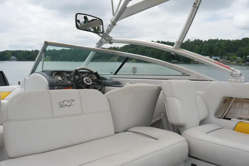 Slide: The Image of 2007 Correct Craft 236 Team Edition boat interior with lake view and sleek design. - 5