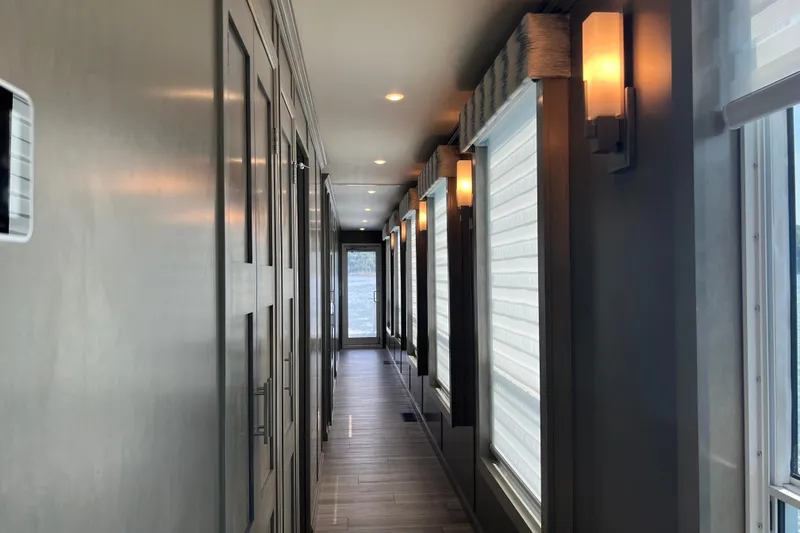 Slide: The Image of Luxurious hallway in 2026 Sumerset Luxe II houseboat, featuring modern lighting and sleek design. - 11