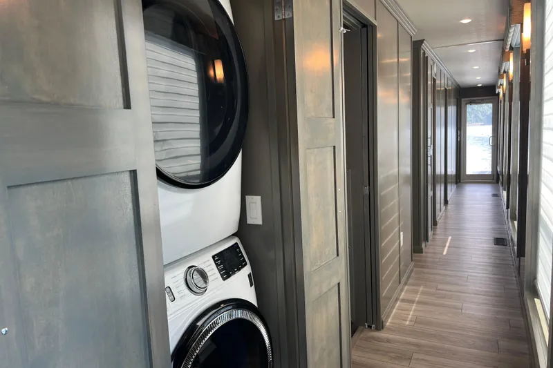 Slide: The Image of Modern hallway in 2026 Sumerset Luxe II with stacked washer and dryer. - 13