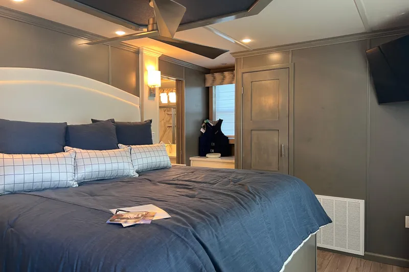 Slide: The Image of Luxurious bedroom interior in 2026 Sumerset Luxe II houseboat, featuring modern decor and cozy bedding. - 27