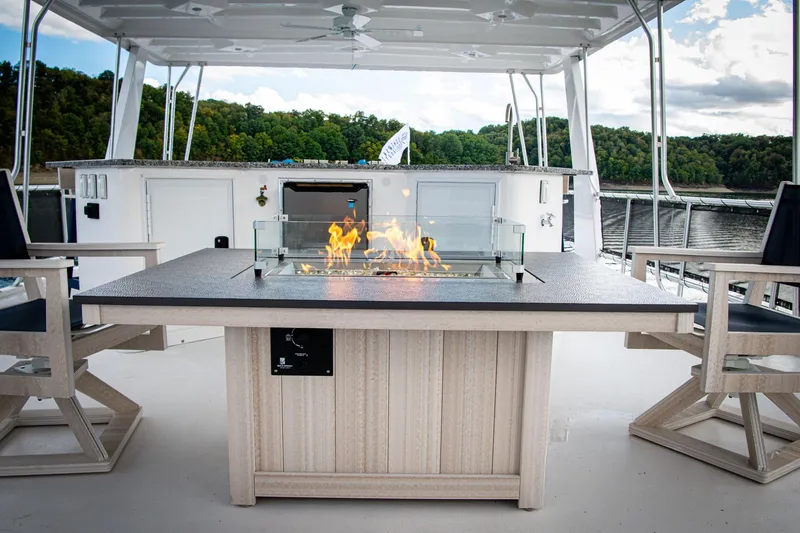 Slide: The Image of Luxurious Sumerset Luxe II 2026 houseboat deck with modern fire pit and seating. - 41